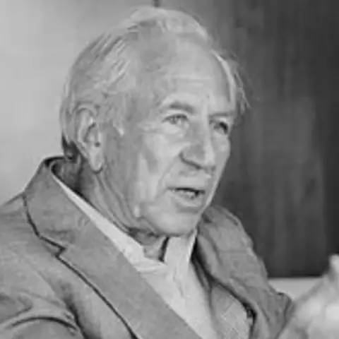 Black and white photo of Alexander Lowen mid-conversation